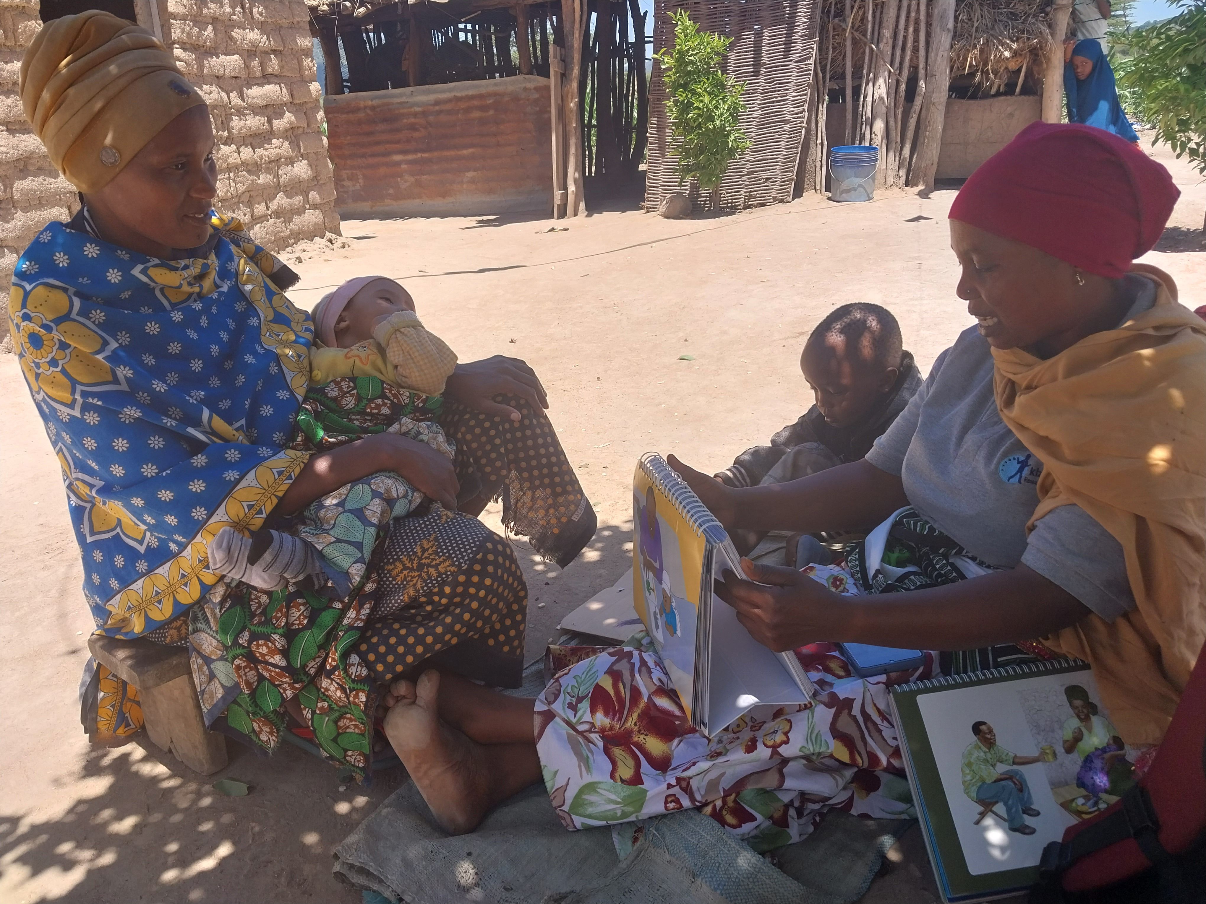 A community health worker visits a mother and infant at home in Dodoma
